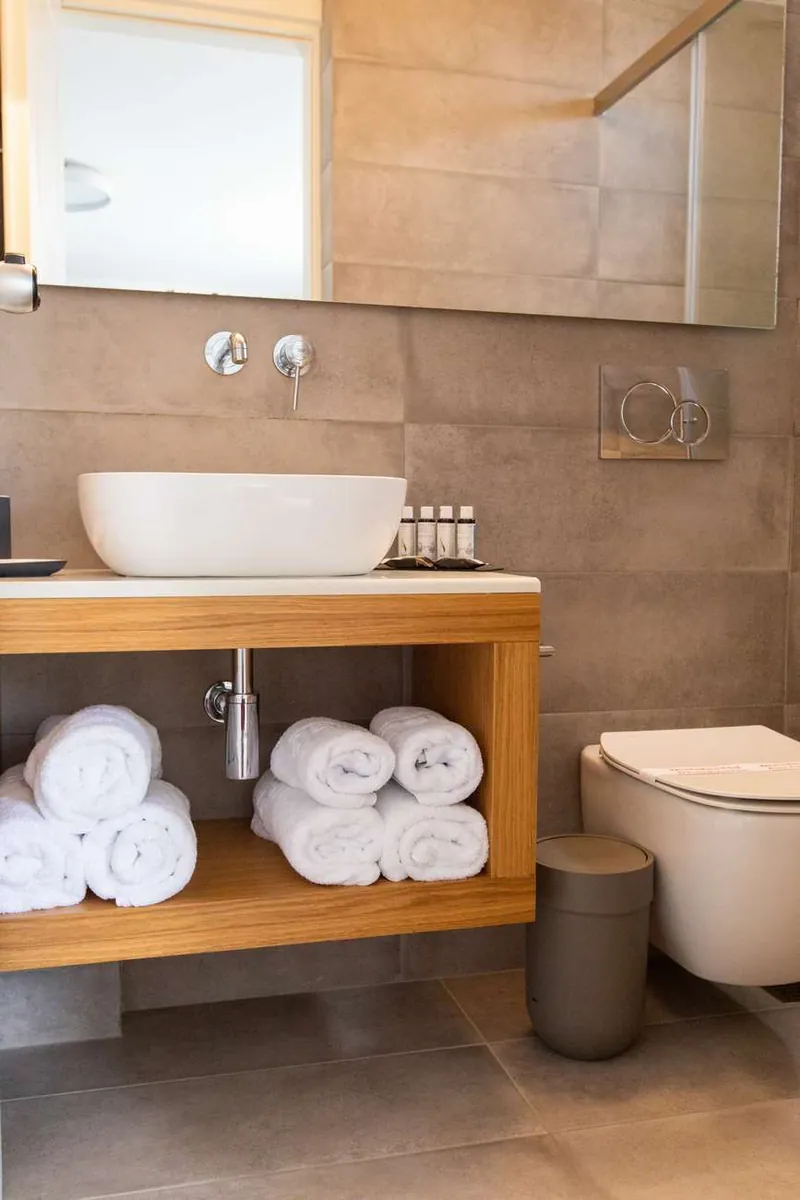 A concrete-look basin and towels