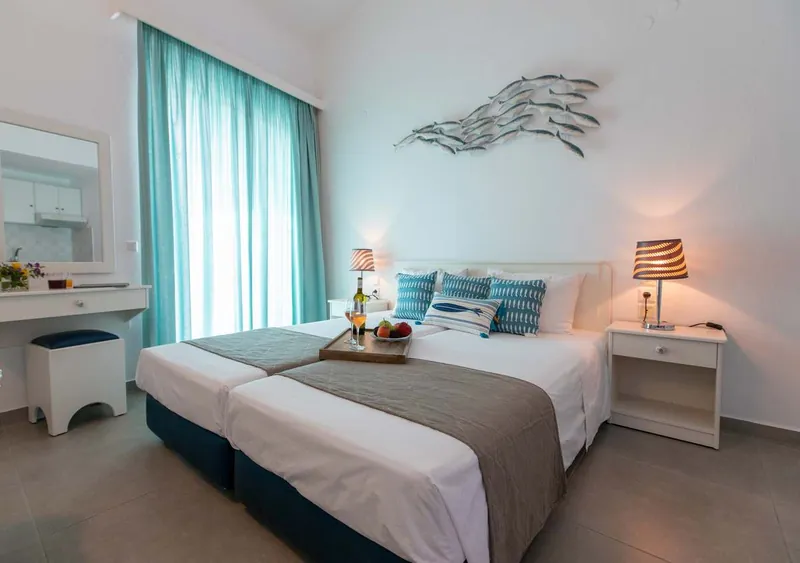 A maisonette bedroom with turquoise curtains
