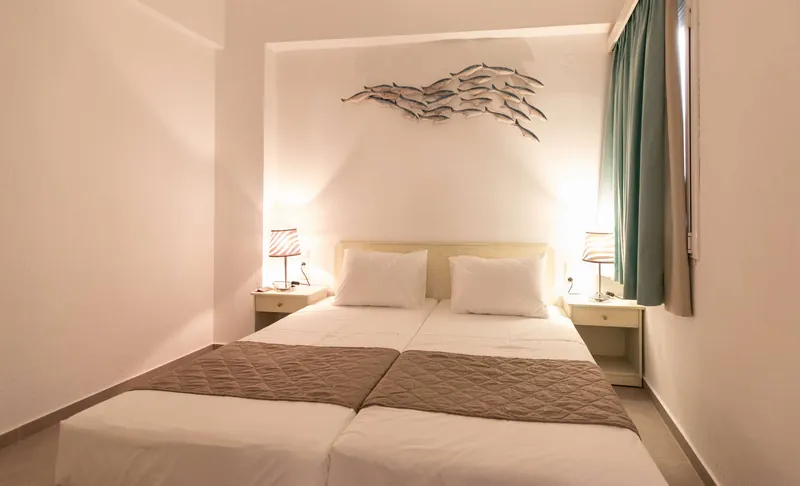 The Triple Apartment bedroom with the silver fish