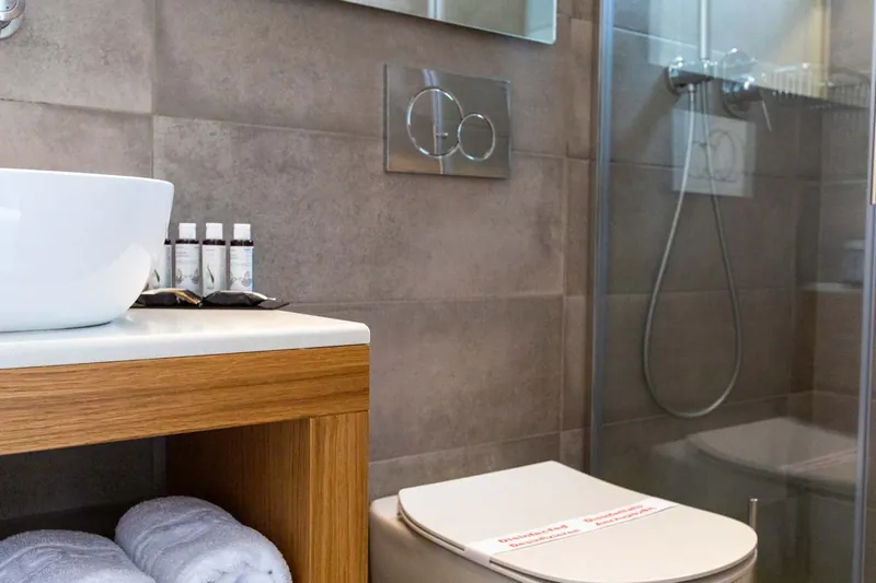 The wall-mounted shower and basin